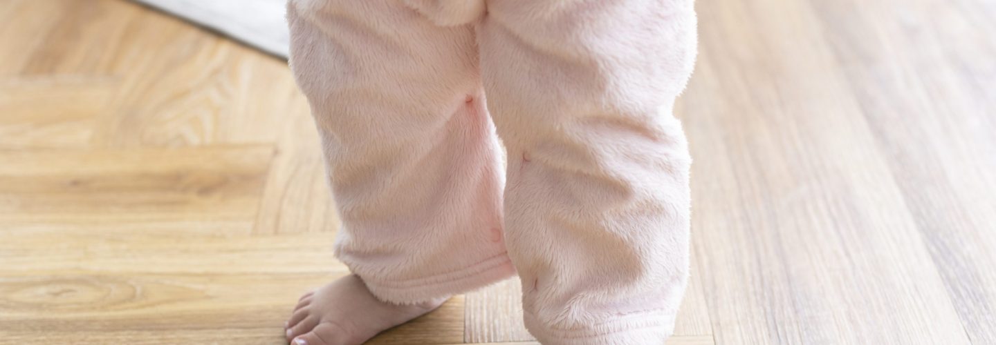 Baby's first steps with cute little feet