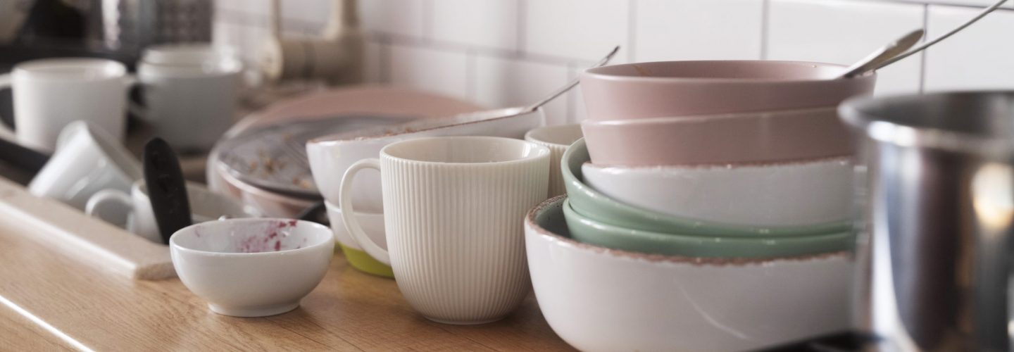 dirty-home-concept-with-dishes-pile