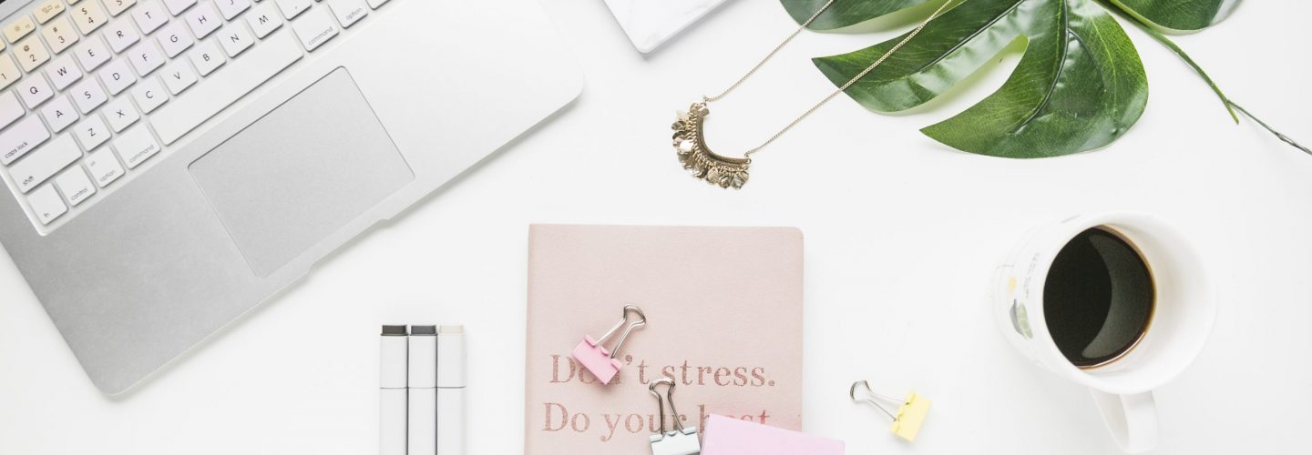 office-desktop-with-coffee-cup-cookies
